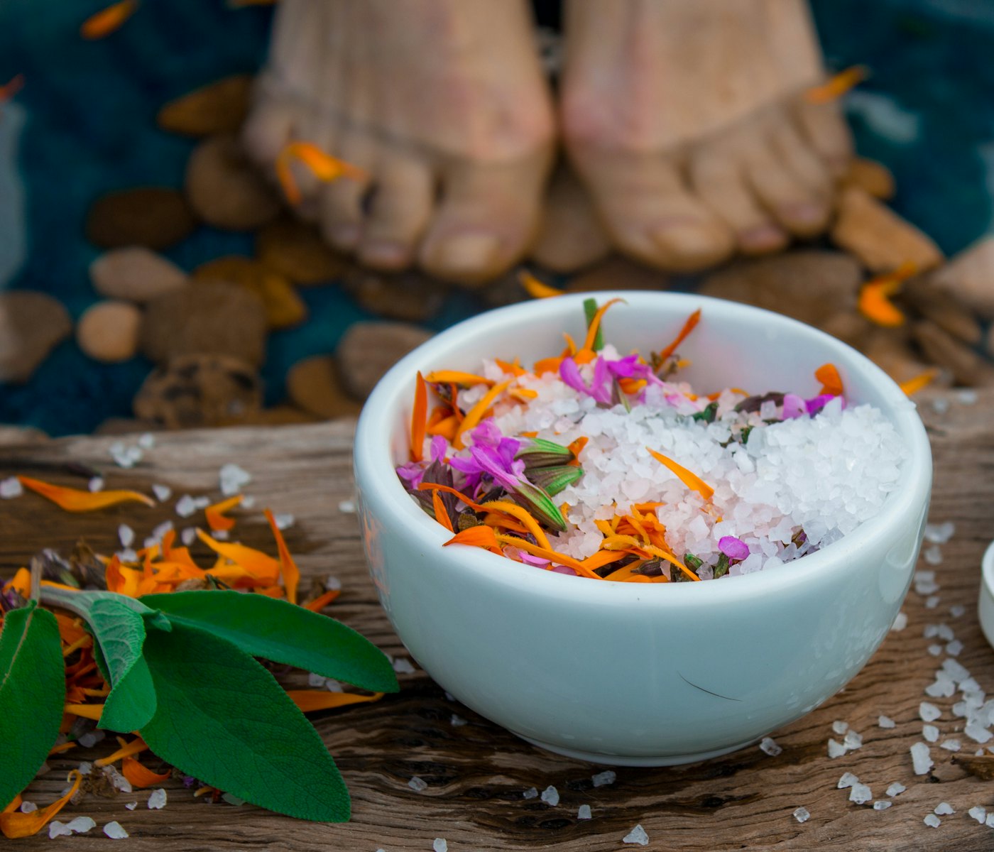 Bowl of bath salt with flower petals for a salt and milk bath in Dubai